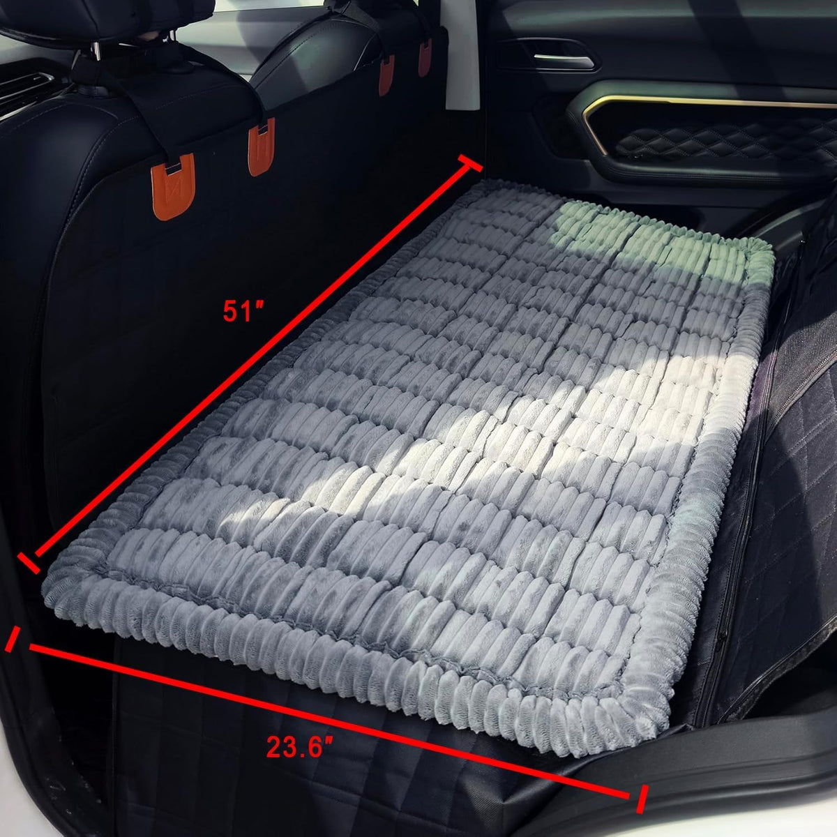 Backseat dog bed mat on a car seat extender
