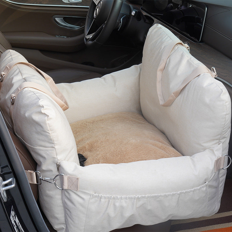 Beige padded dog travel bed for car seat